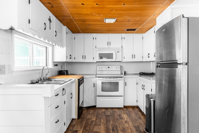 kitchen with white appliances, white cabinets, wooden ceiling, and sink