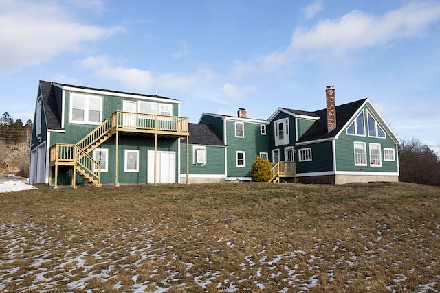 rear view of property featuring a deck