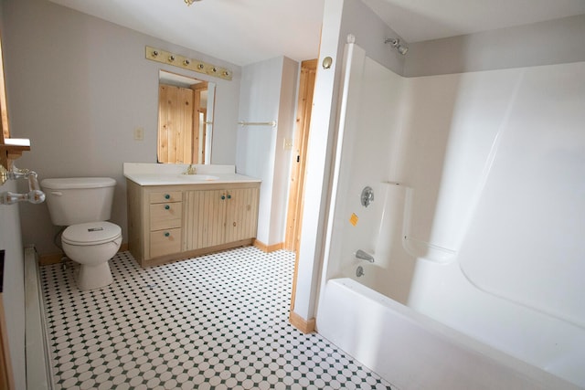 full bathroom with toilet, tile floors, large vanity, and tub / shower combination