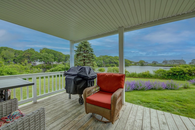 2 Maddox Pond Rd, Biddeford, ME 04005 - wooden terrace with a water view, a lawn, and a grill