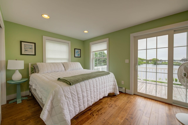 2 Maddox Pond Rd, Biddeford, ME 04005 - bedroom featuring access to exterior, hardwood / wood-style flooring, a water view, a baseboard radiator, and recessed lighting