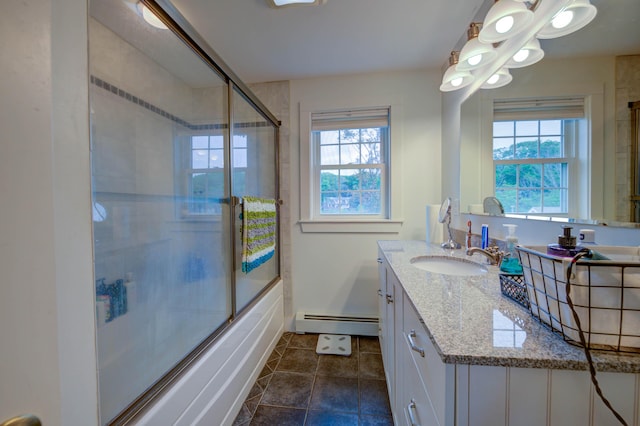 2 Maddox Pond Rd, Biddeford, ME 04005 - full bathroom featuring baseboard heating, combined bath / shower with glass door, healthy amount of natural light, and vanity
