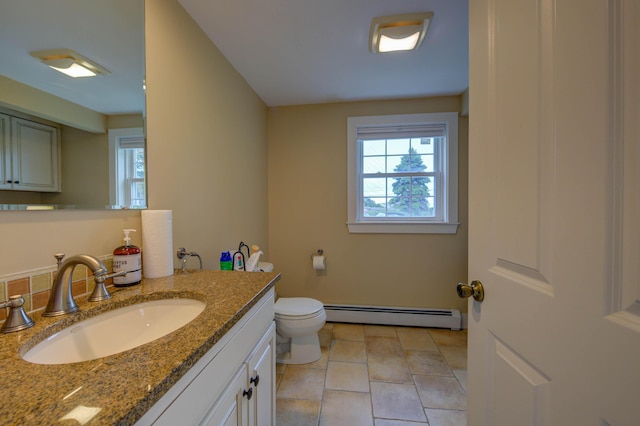 2 Maddox Pond Rd, Biddeford, ME 04005 - bathroom featuring a baseboard heating unit, vanity, and tile patterned floors