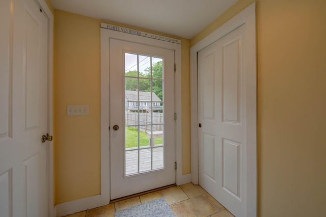 2 Maddox Pond Rd, Biddeford, ME 04005 - doorway to outside with light tile patterned floors and baseboards