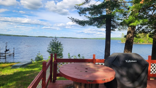 21 Greystone Ln Unit T4, Indian Purchase Twp, ME 04462 - wooden deck featuring grilling area, a water view, and a boat dock