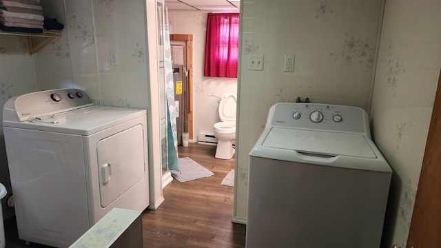 21 Greystone Ln Unit T4, Indian Purchase Twp, ME 04462 - laundry room featuring dark wood finished floors, a baseboard radiator, and washing machine and clothes dryer