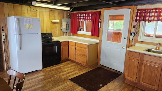 21 Greystone Ln Unit T4, Indian Purchase Twp, ME 04462 - kitchen with freestanding refrigerator, black range with electric stovetop, electric panel, wood finished floors, and light countertops