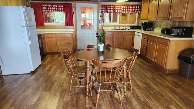 21 Greystone Ln Unit T4, Indian Purchase Twp, ME 04462 - kitchen featuring white appliances, dark wood-style flooring, light countertops, and brown cabinets