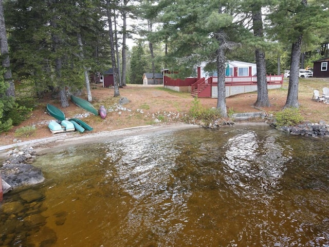 21 Greystone Ln Unit T4, Indian Purchase Twp, ME 04462 - view of yard featuring a wooden deck and view of wooded area