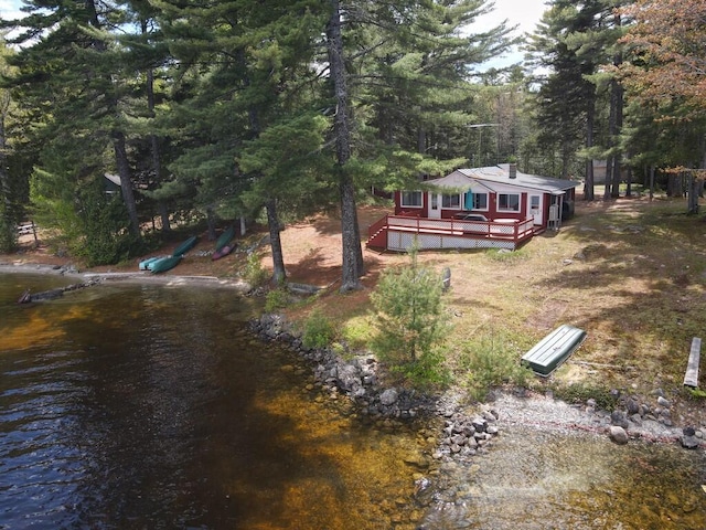 21 Greystone Ln Unit T4, Indian Purchase Twp, ME 04462 - view of yard featuring a wooden deck and a forest view