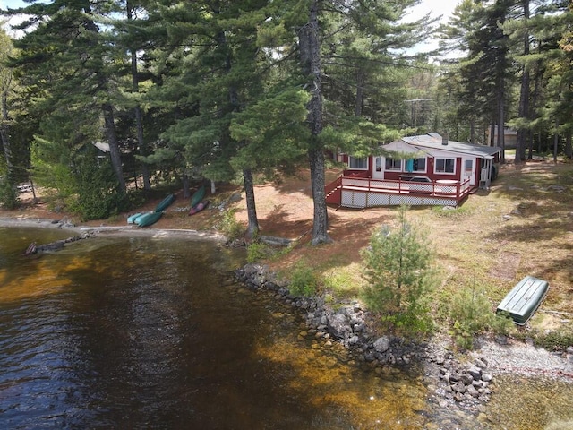 21 Greystone Ln Unit T4, Indian Purchase Twp, ME 04462 - view of yard with a deck and a wooded view