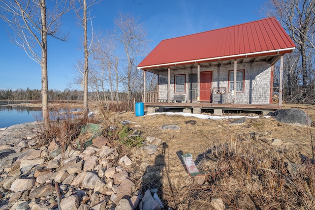 view of front of home featuring a water view