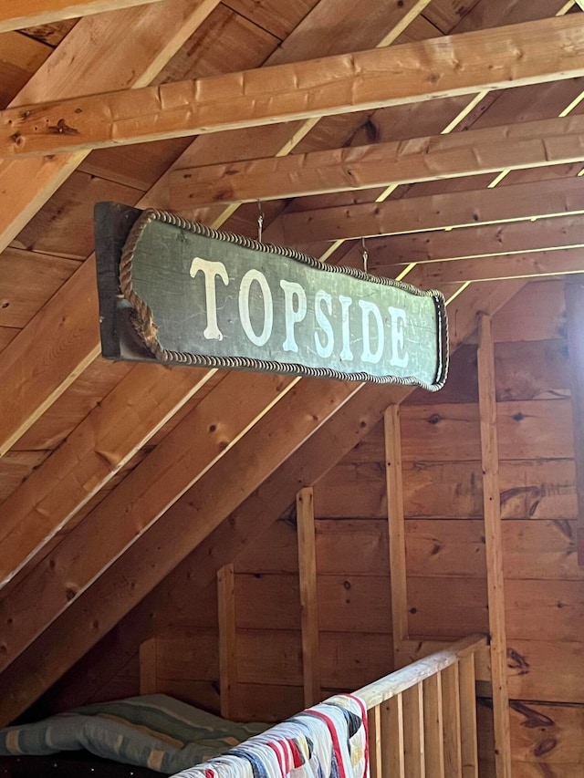 room details featuring wood ceiling and wooden walls