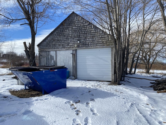 view of snow covered garage