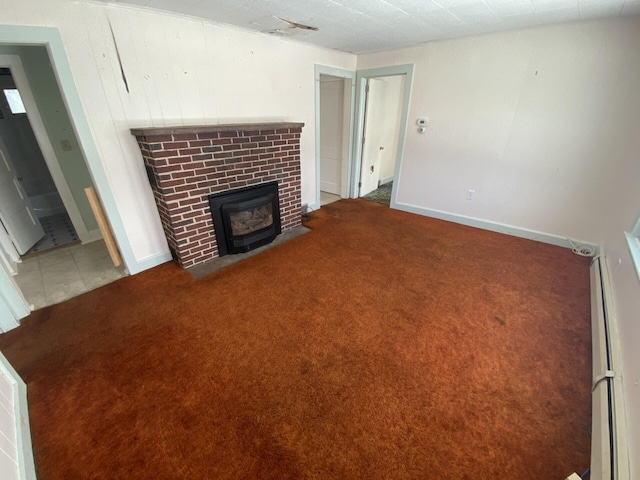 unfurnished living room with light colored carpet and a brick fireplace