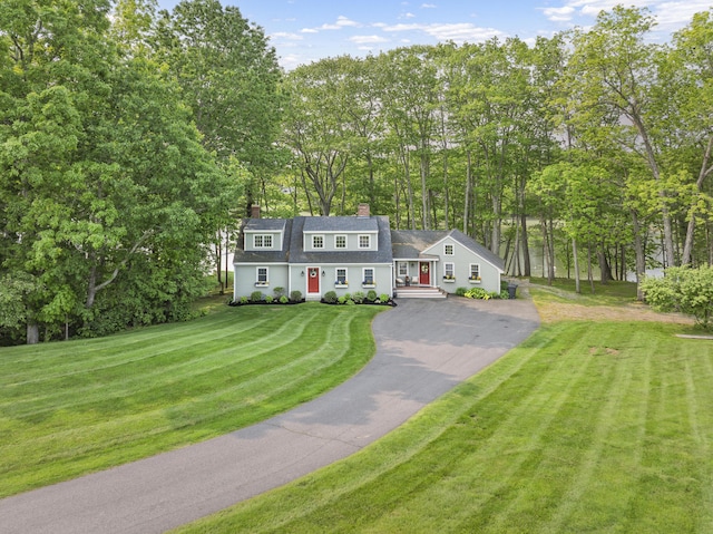 8 Hickory Ln, York, ME 03909 - dutch colonial with asphalt driveway, view of scattered trees, roof with shingles, a chimney, and a front yard