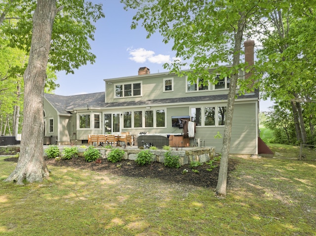 8 Hickory Ln, York, ME 03909 - back of property featuring a chimney and a patio