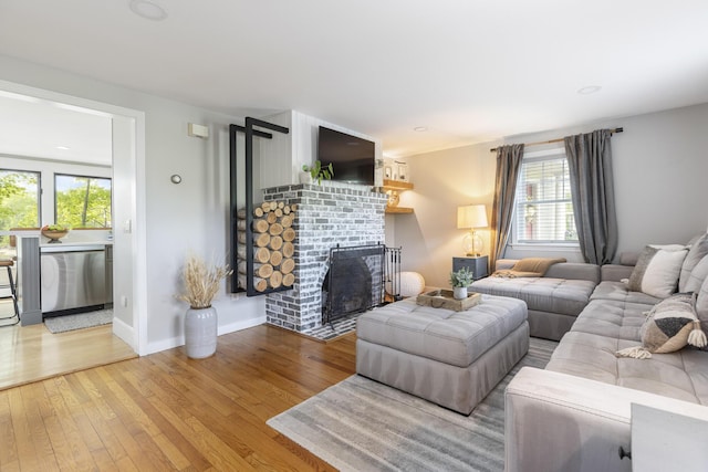 8 Hickory Ln, York, ME 03909 - living room featuring plenty of natural light, hardwood / wood-style flooring, a fireplace, and baseboards