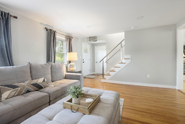 8 Hickory Ln, York, ME 03909 - living area featuring light wood-type flooring, baseboards, and stairs