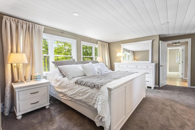 8 Hickory Ln, York, ME 03909 - bedroom with dark colored carpet and wooden ceiling
