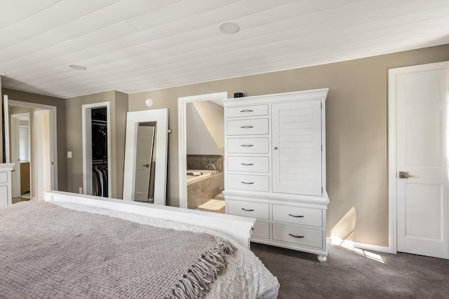 8 Hickory Ln, York, ME 03909 - bedroom with dark carpet, a walk in closet, ensuite bath, baseboards, and a closet