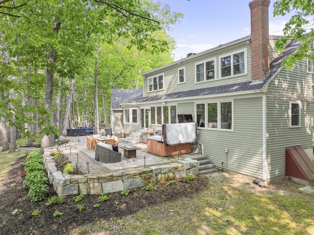 8 Hickory Ln, York, ME 03909 - rear view of house featuring a patio, a hot tub, an outdoor living space, a chimney, and a shingled roof