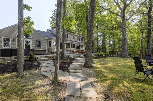 8 Hickory Ln, York, ME 03909 - view of front of property featuring a chimney, a patio area, and a front lawn