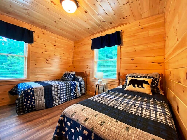 bedroom featuring wooden ceiling, wood walls, and dark wood-type flooring