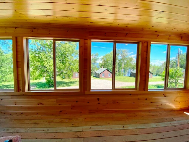 unfurnished sunroom with plenty of natural light