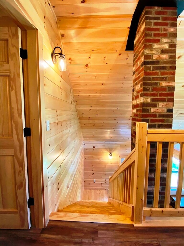 stairway with brick wall and wood walls