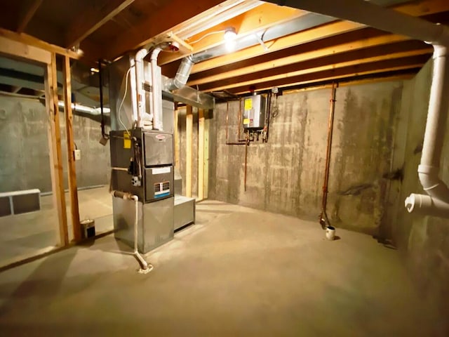 basement featuring electric water heater