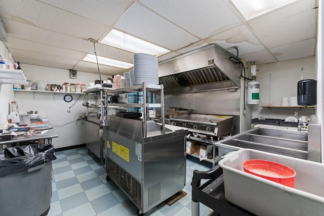 kitchen with tile patterned floors, open shelves, and a drop ceiling