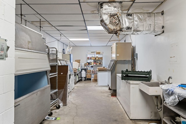 basement featuring a drop ceiling