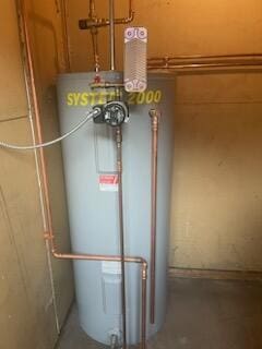 utility room featuring water heater