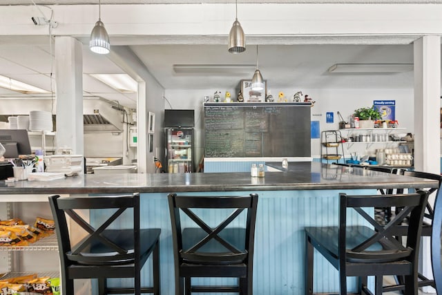 kitchen featuring dark countertops and decorative light fixtures