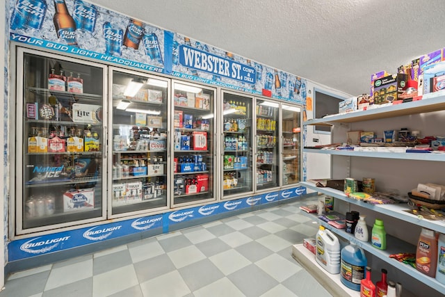 interior space featuring tile patterned floors and a textured ceiling