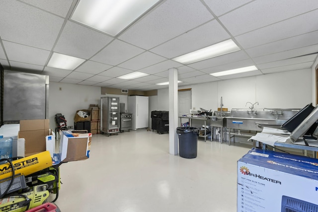 basement with visible vents and a drop ceiling