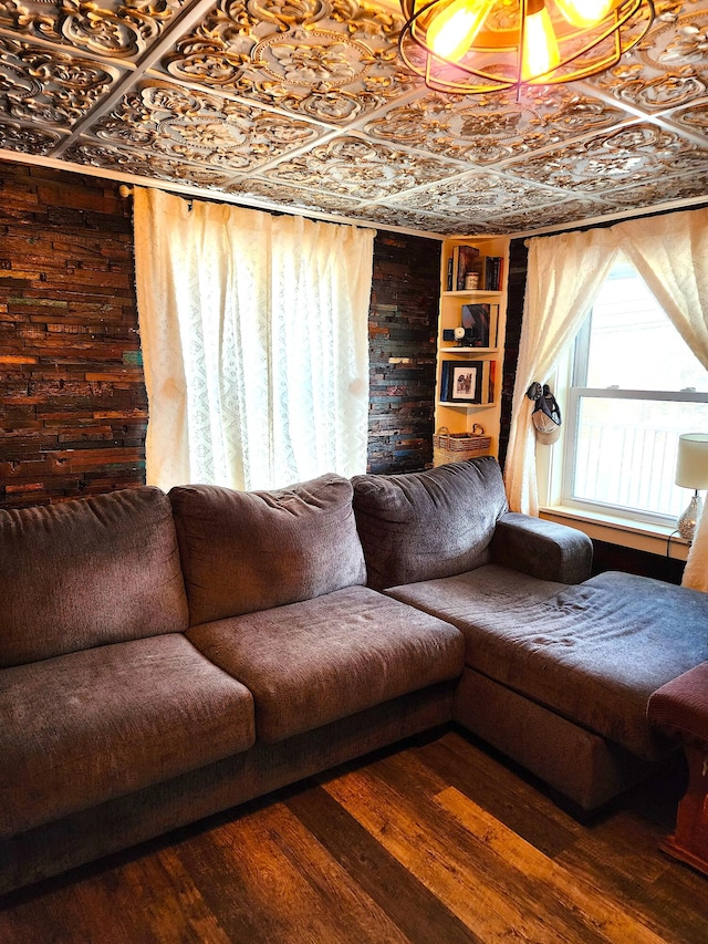 living room featuring wooden walls and hardwood / wood-style floors