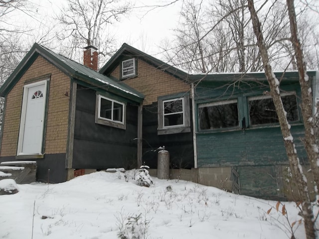 view of snow covered house