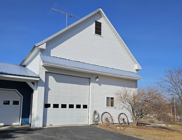 view of side of property with a garage