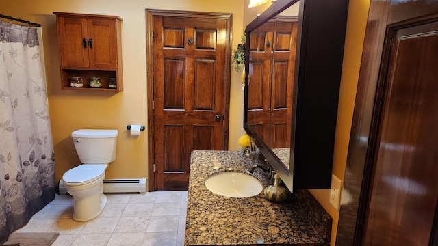 bathroom featuring tile flooring, baseboard heating, vanity, and toilet