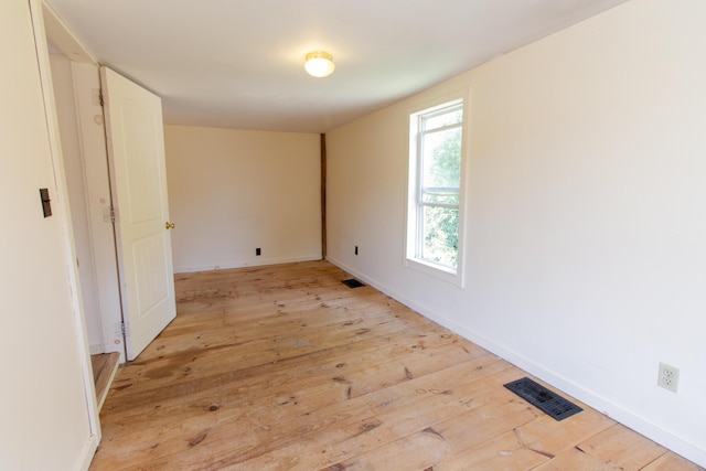 unfurnished room featuring light hardwood / wood-style flooring