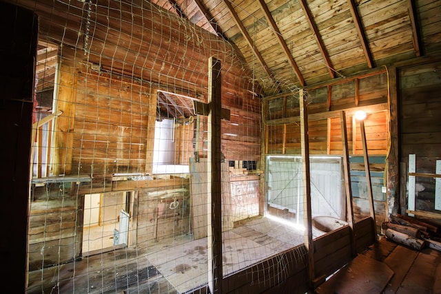 interior space with vaulted ceiling with beams and wood ceiling