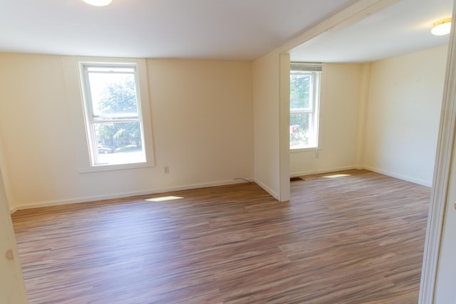 spare room featuring light hardwood / wood-style floors