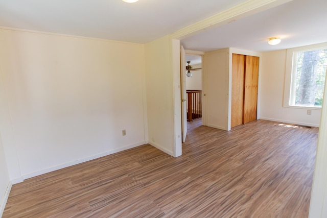 spare room with hardwood / wood-style flooring