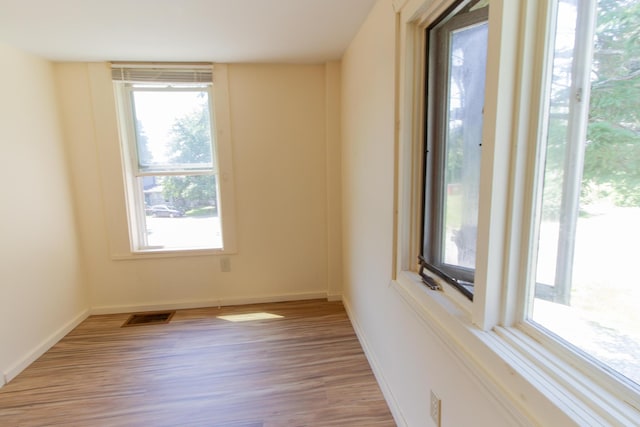 unfurnished room featuring light hardwood / wood-style flooring