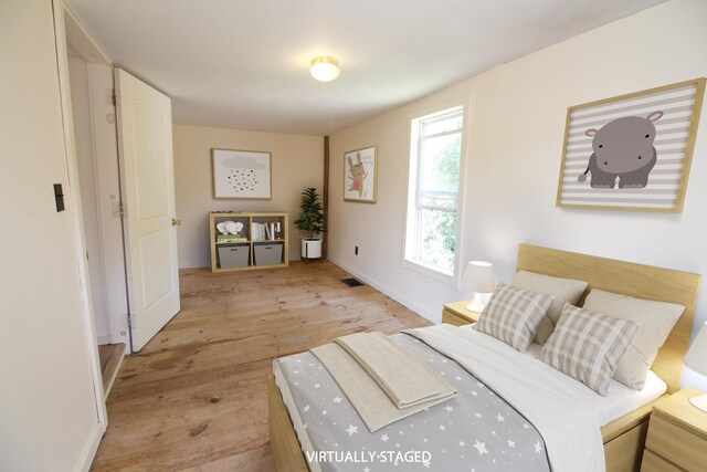 bedroom featuring light hardwood / wood-style floors