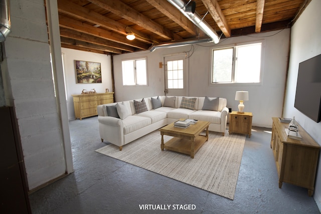 living room featuring beamed ceiling, wood ceiling, and a wealth of natural light