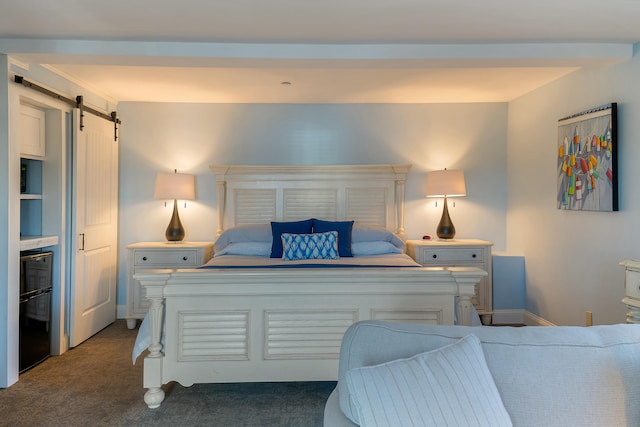 carpeted bedroom with a barn door