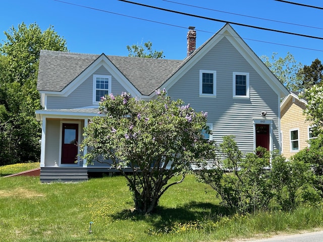 view of front of home with a front lawn